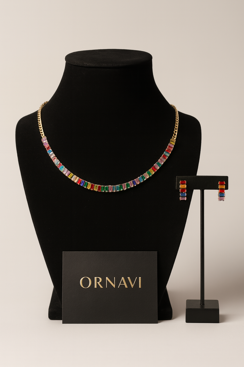 Colorful necklace and earrings on a black mannequin with 'ORNAVI' branding.