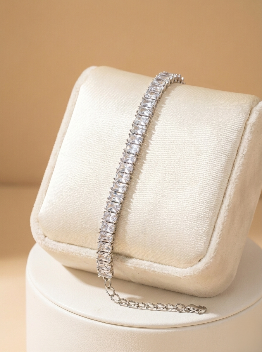Diamond bracelet on a white cushion with a beige background