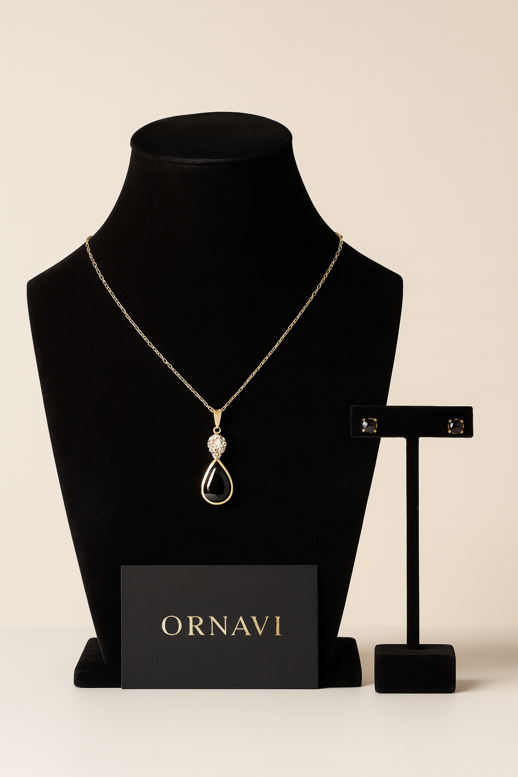 Gold necklace on a black mannequin bust with 'ORNAVI' branding on a beige background