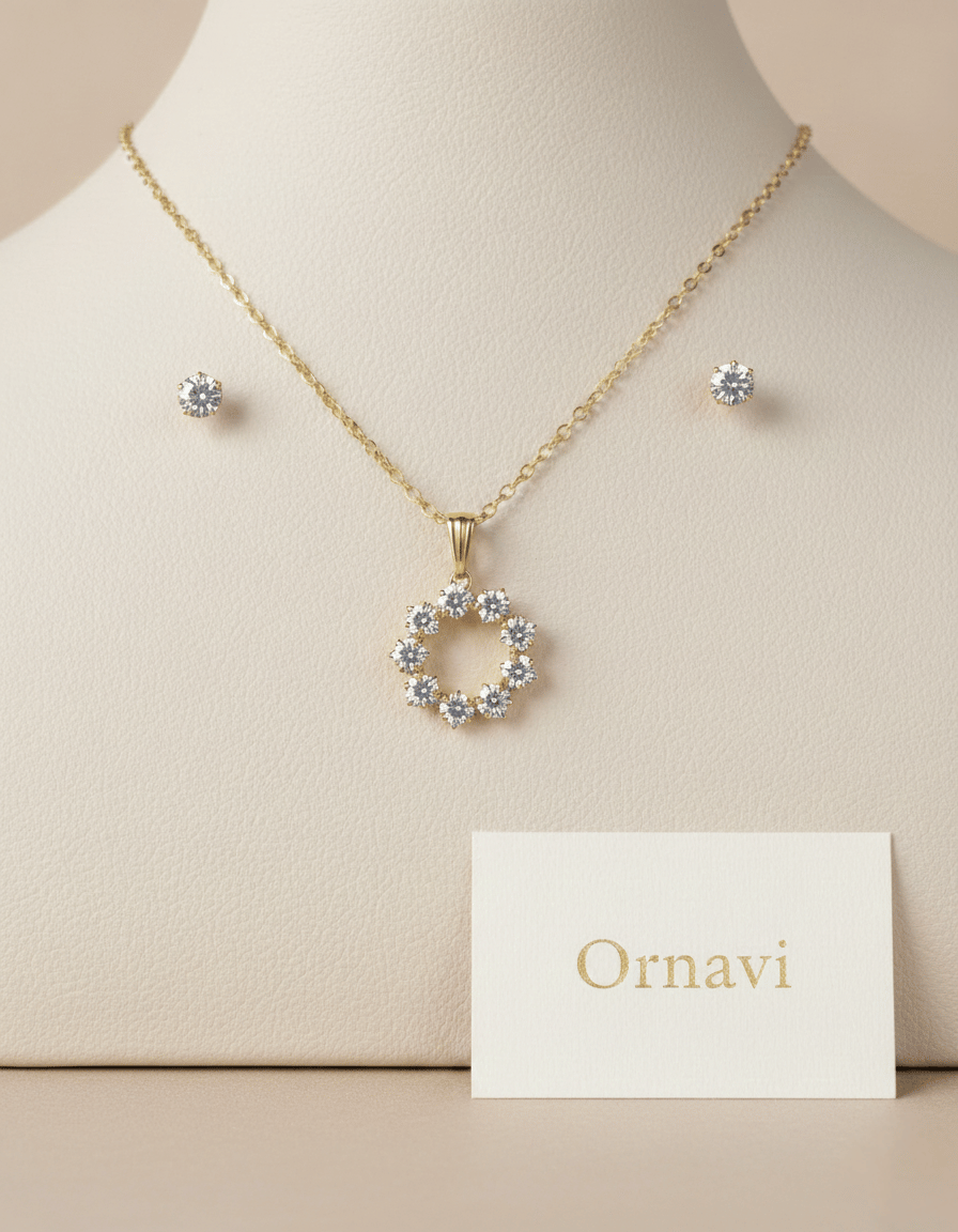 Gold necklace with circular pendant and matching earrings on a mannequin bust, with 'Ornavi' card below.