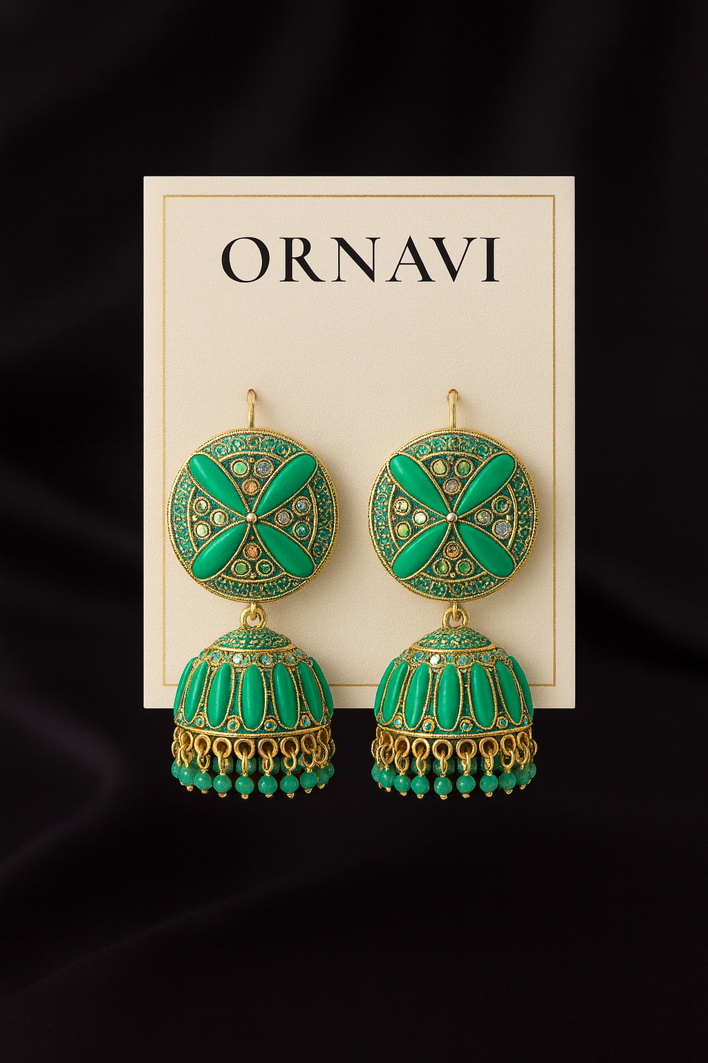 Green and gold earrings on an ORNAVI branded card against a black background