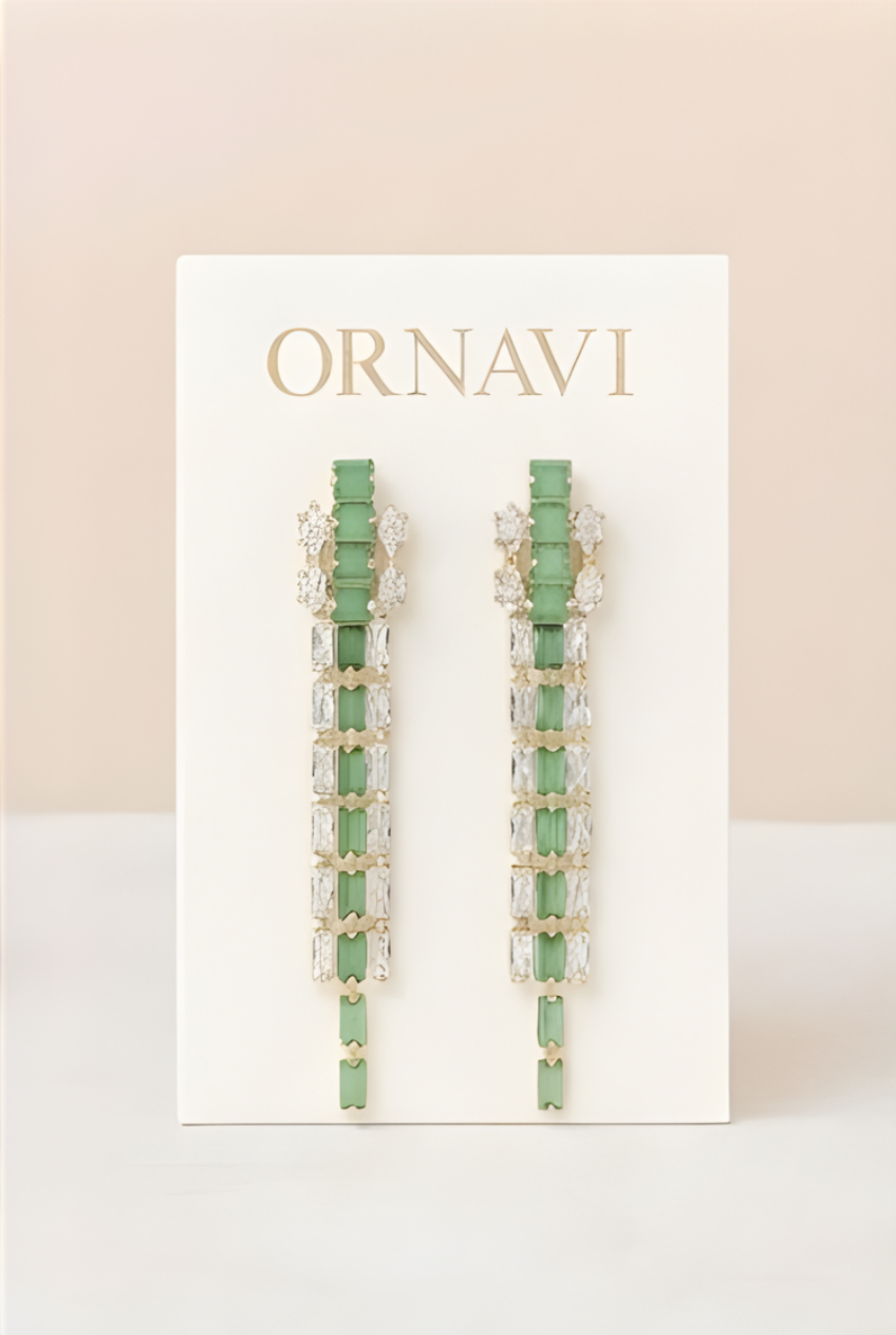 Green beaded earrings on a white card with 'ORNAVI' branding against a beige background