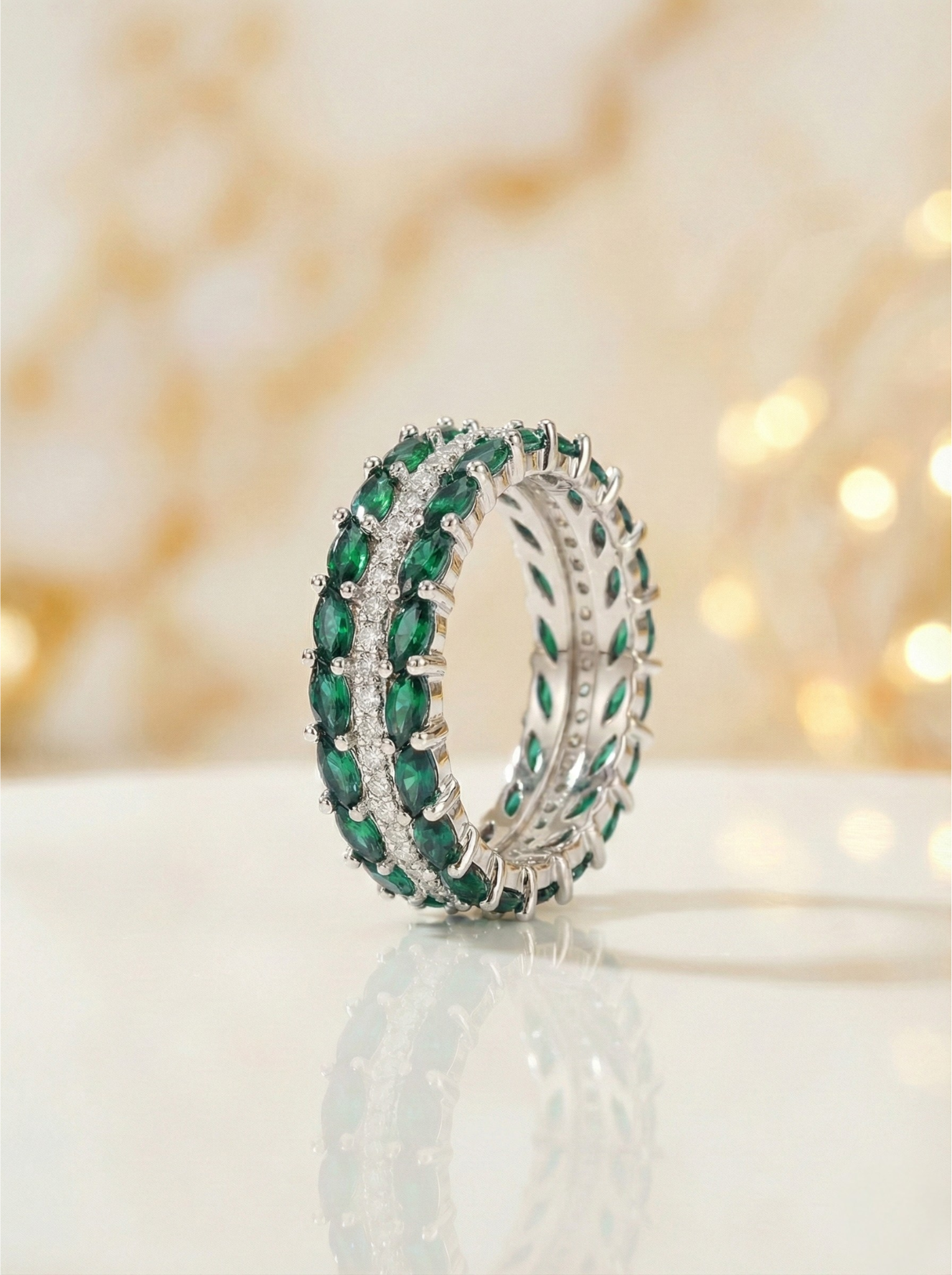 Green gemstone ring with a blurred light background