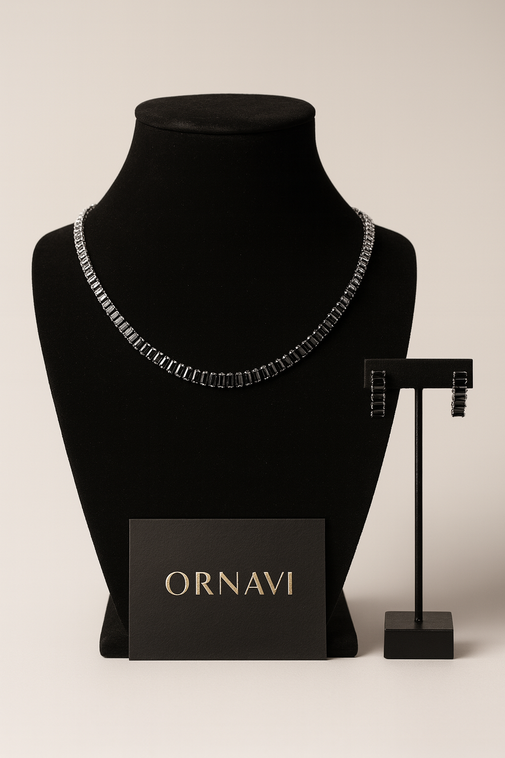 Necklace on a mannequin bust with 'ORNAVI' branding, accompanied by a card and stand.