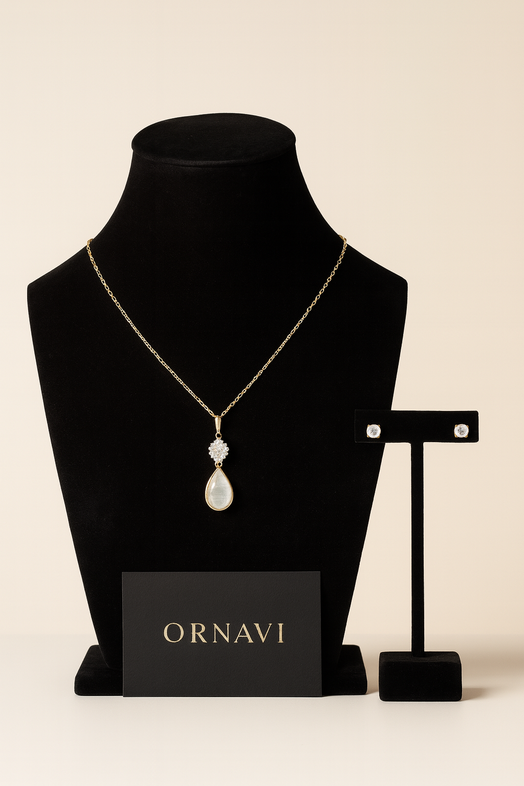 Necklace with pendant on a black mannequin bust with 'ORNAVI' branding on a beige background