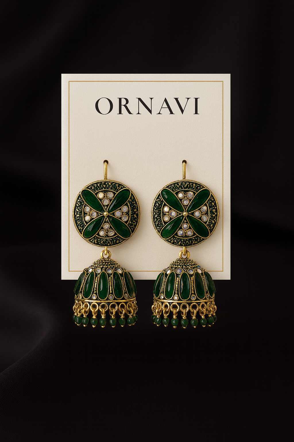 Ornate earrings on a 'ORNAVI' branded card against a black background