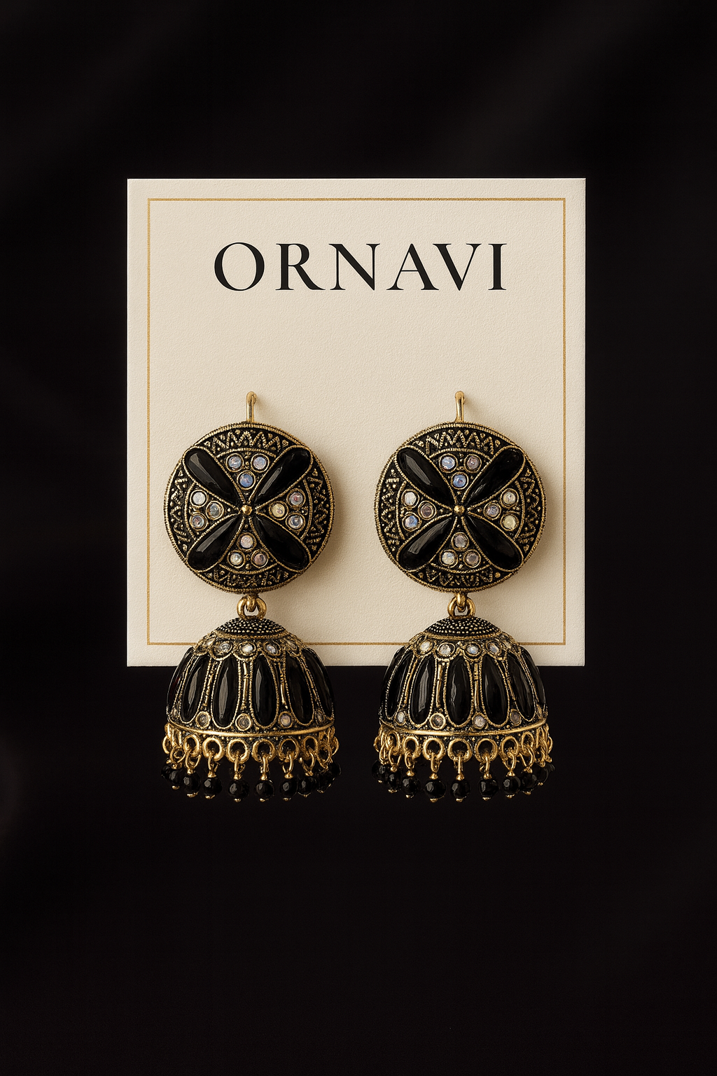 Ornate earrings on a 'ORNAVI' branded card against a black background
