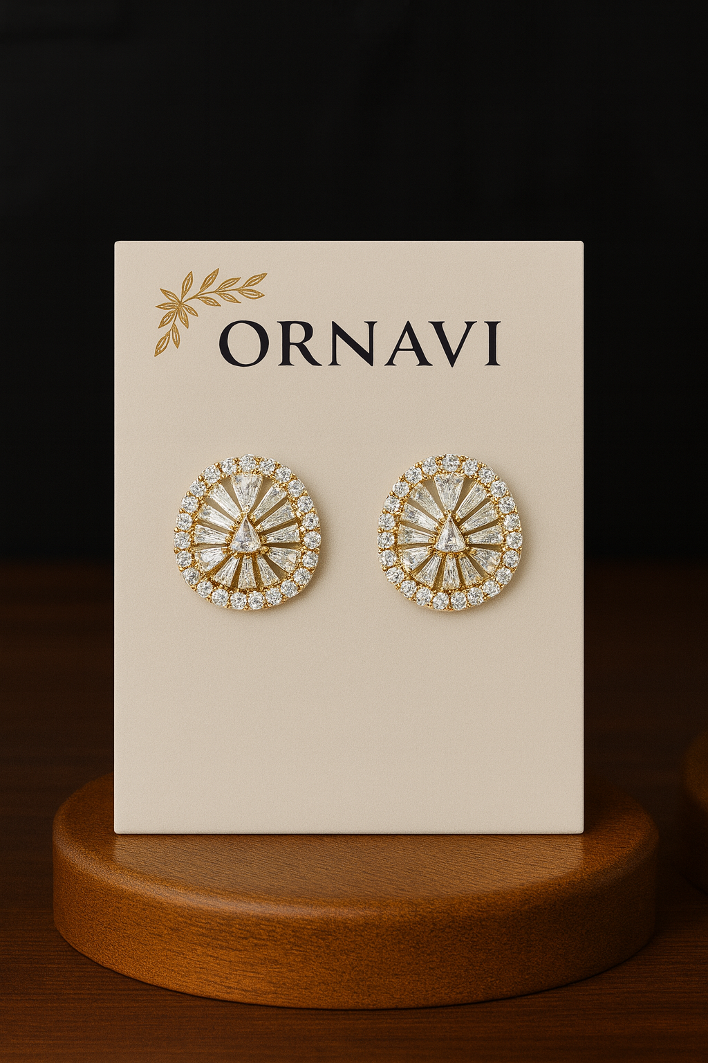 Ornate earrings on a 'ORNAVI' branded card with a dark background